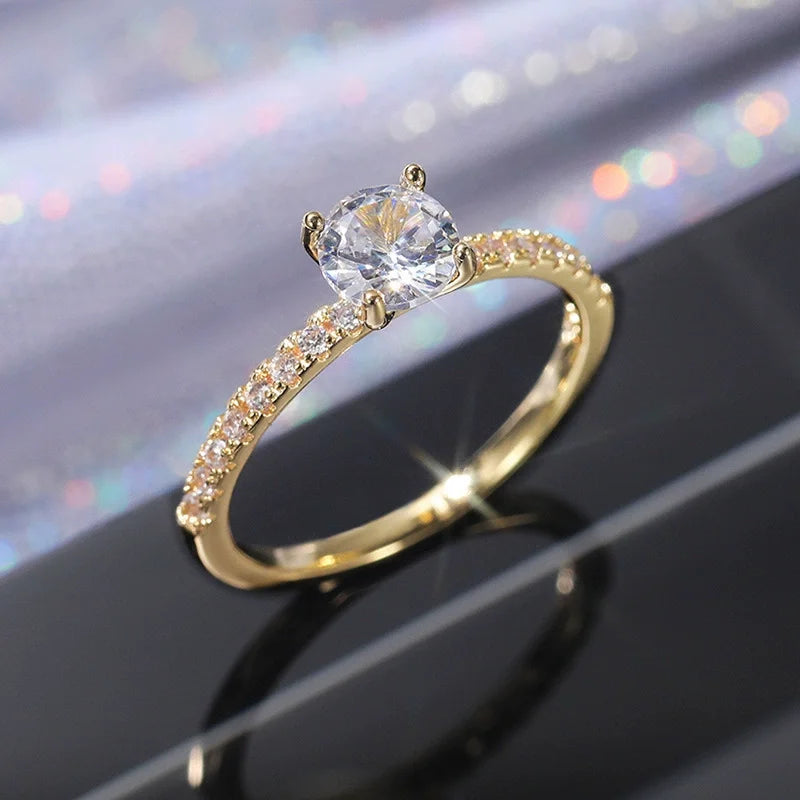 “Elegant Gold-Tone Ring with Sparkling Glass Diamonds”